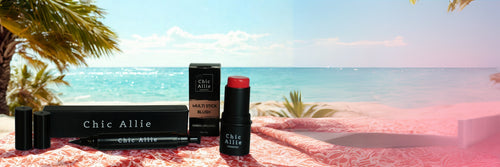 Chic Allie products on a beach with palm trees and ocean view