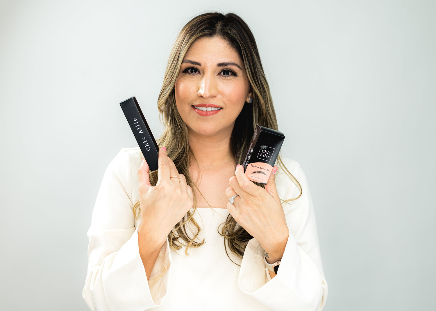 CHIC ALLIE EYEBROW STAMP AND EYELINER HOLDING JUDITH CHAPMAN